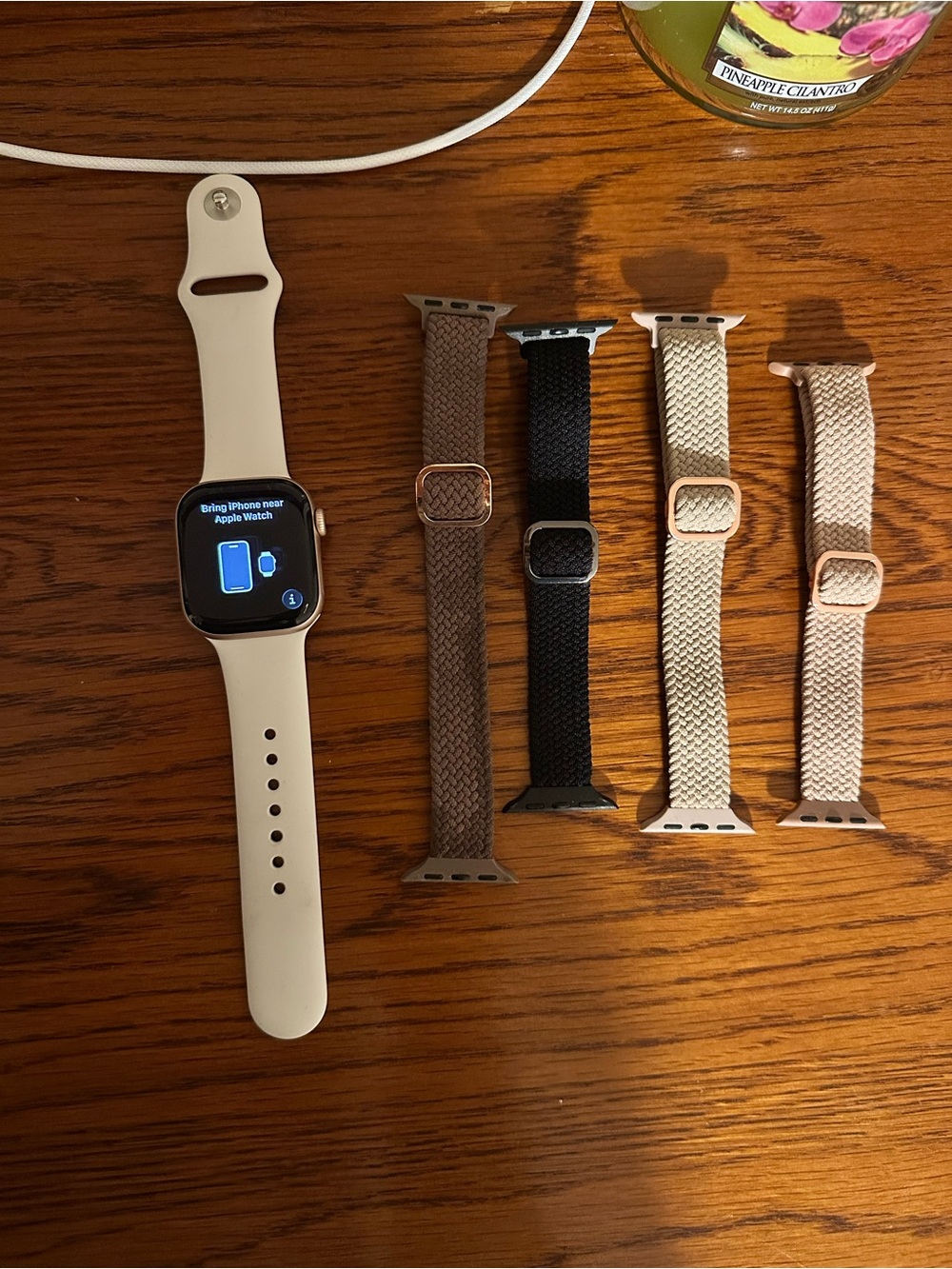 Apple Watch with Beige Sport Band and Multiple Braided Solo Loop Straps